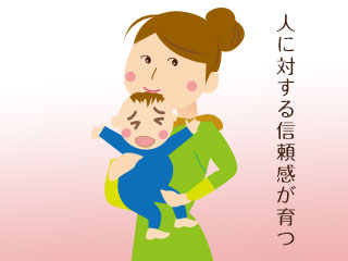 赤ちゃんを抱き上げる母親