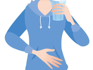 お腹を押さえる女性
