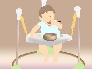 歩行器のテーブルで食事する赤ちゃん