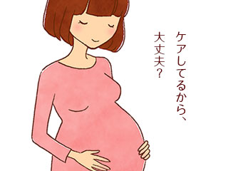 妊婦がお腹を触っている