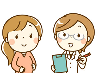 女医から症状を聞かれる妊婦