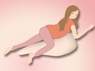 シムスの姿勢で寝る妊婦