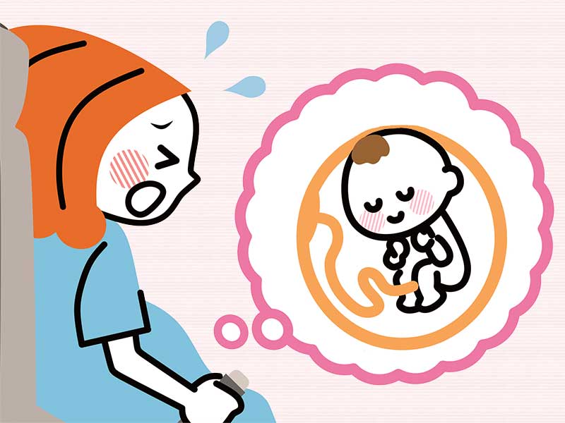 逆子で苦しんでる妊婦のイラスト