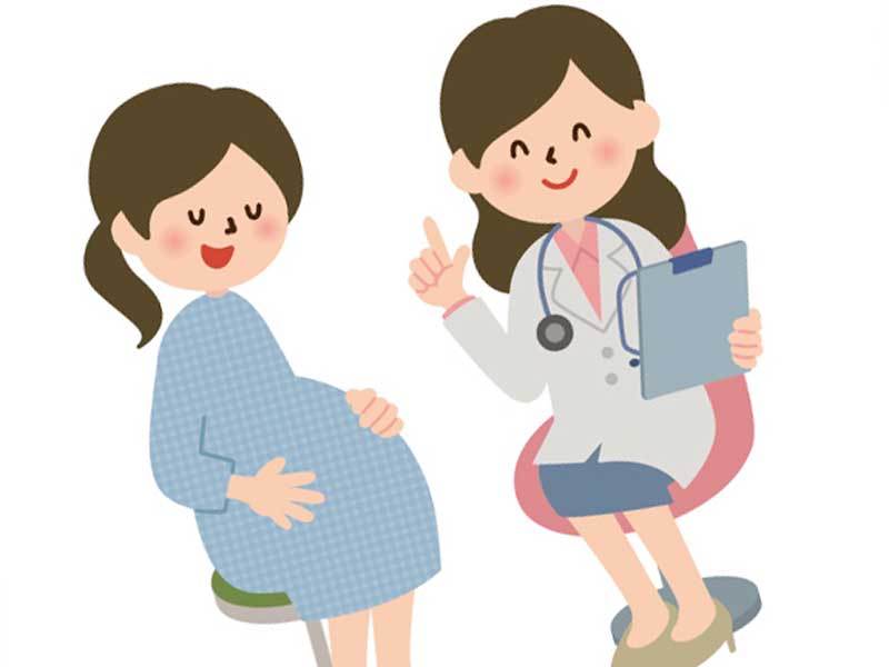 診察する医師と妊婦さんのイラスト