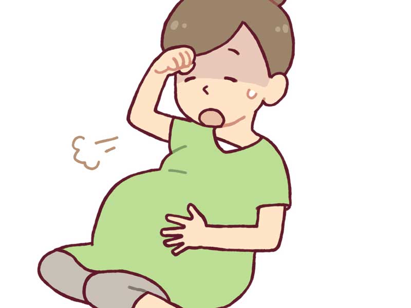 めまいがして辛そうな妊婦さんのイラスト