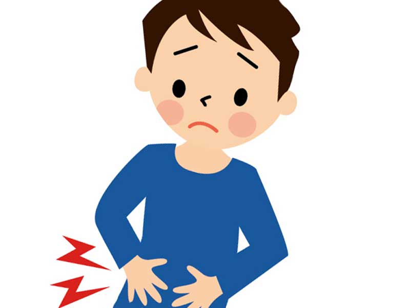 下腹部を痛がっている男の子のイラスト