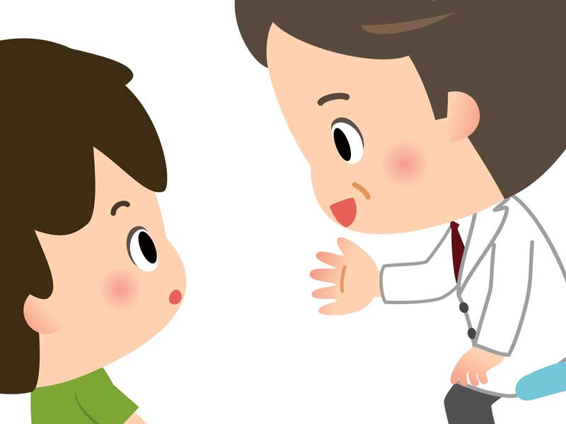 病院で診察を受けている男の子のイラスト