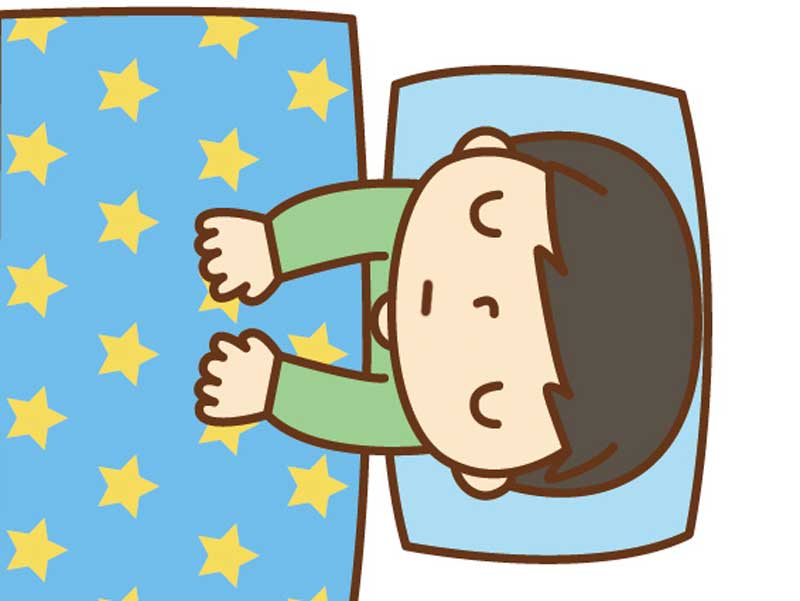 学校を休んで寝ている男の子のイラスト