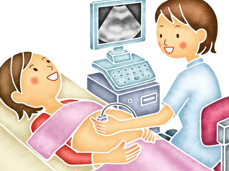 健診で超音波検査をしている妊婦さん