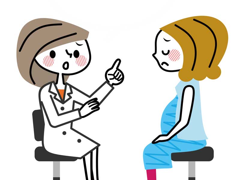 医師と相談する臨月の妊婦さんのイラスト