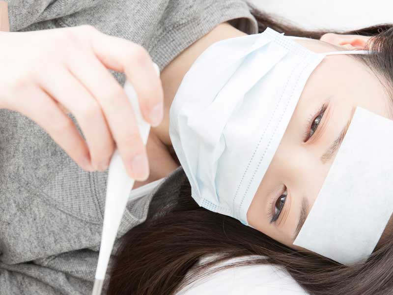 体調不良の女性