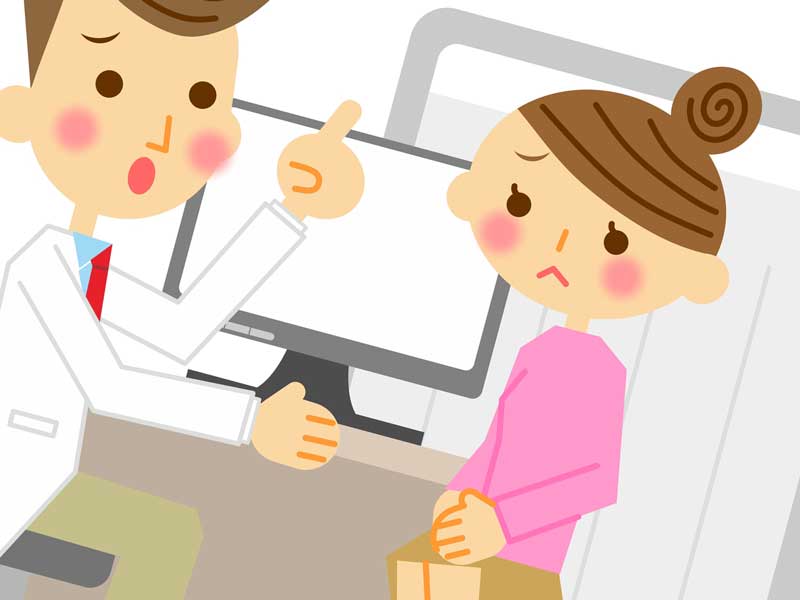 病院で医者に相談している主婦のイラスト