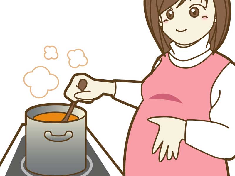 料理をしている妊婦さんのイラスト
