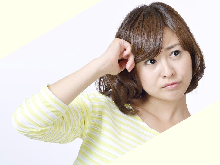悩む女性の表情