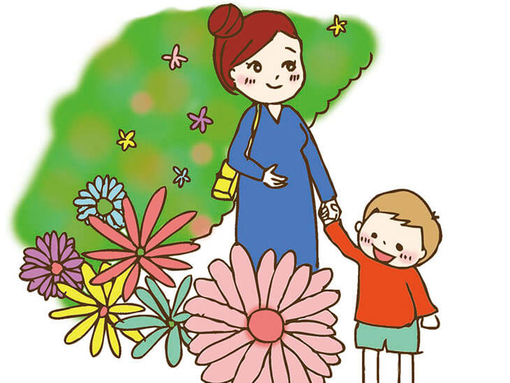 子供と散歩する妊婦