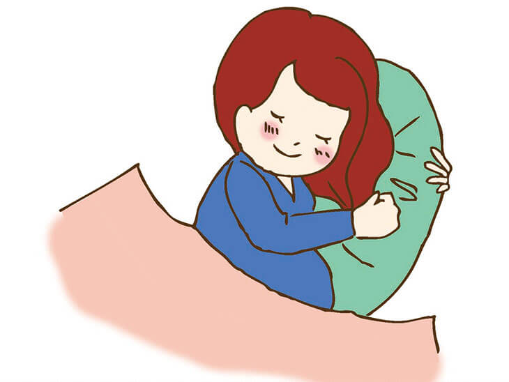 十分な睡眠をとる妊婦