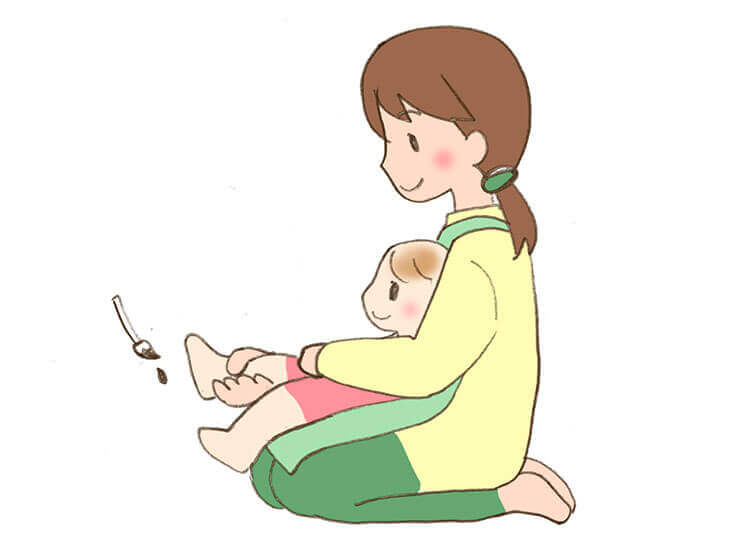 足形を取る時の赤ちゃんの抱き方のイラスト