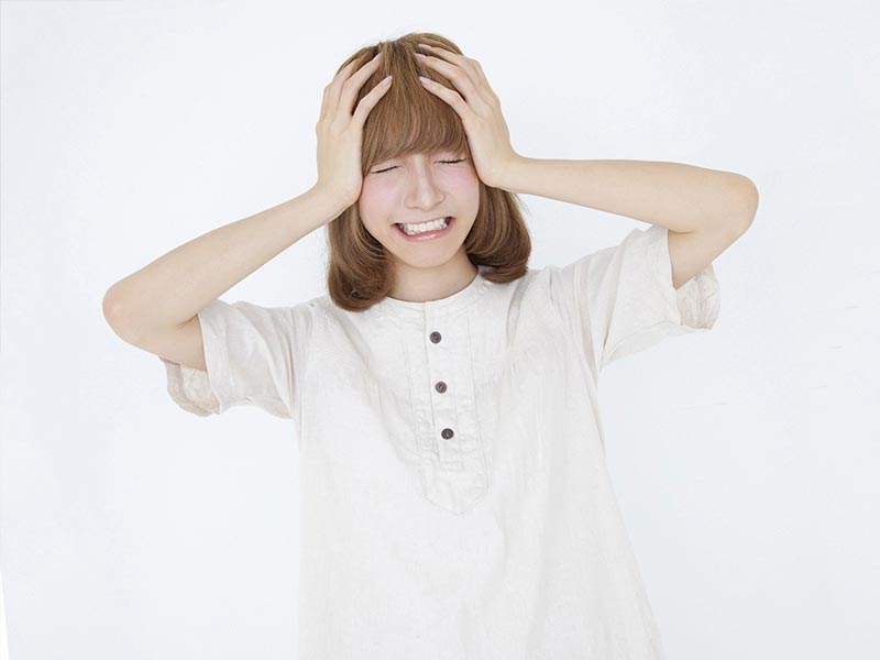 体調不良の女性